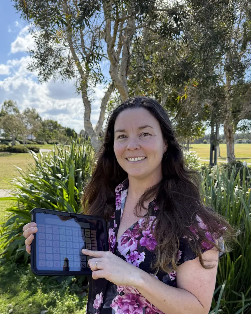 Leia holding a tablet showing a communication app